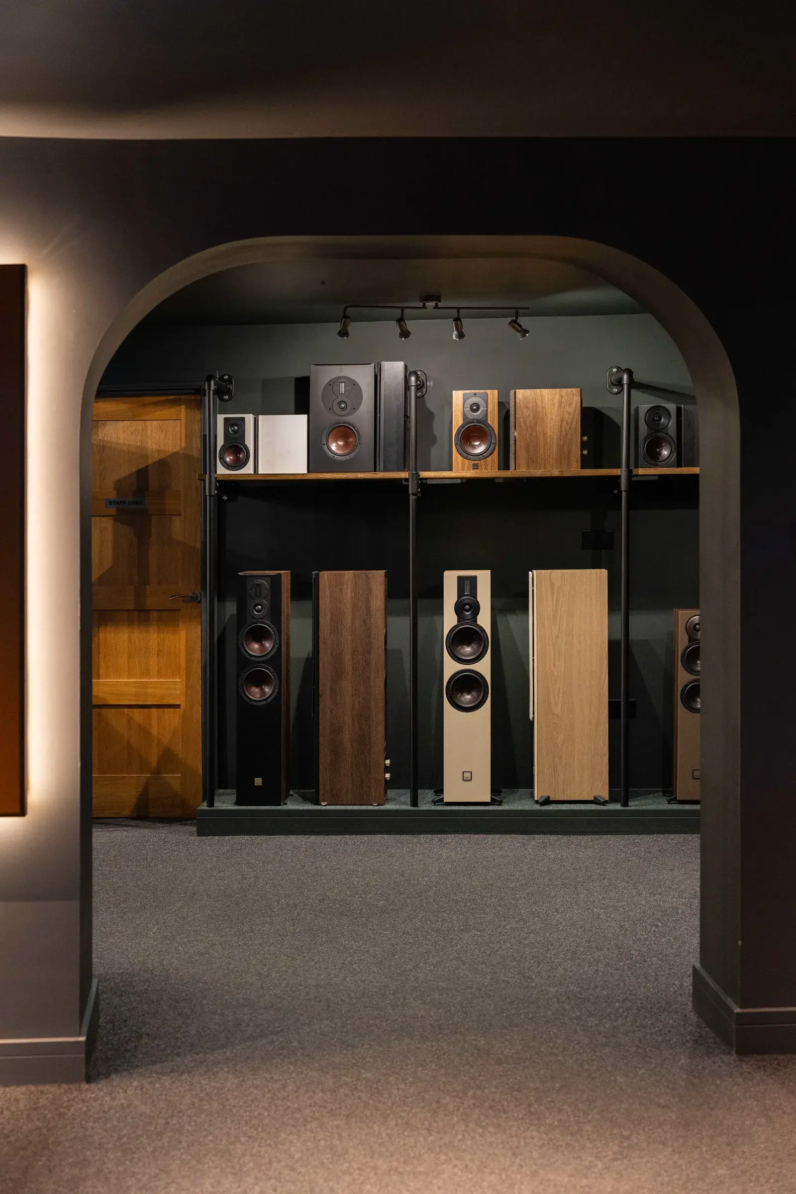 Floorstanding and standmount loudspeakers set up side by side for demonstration